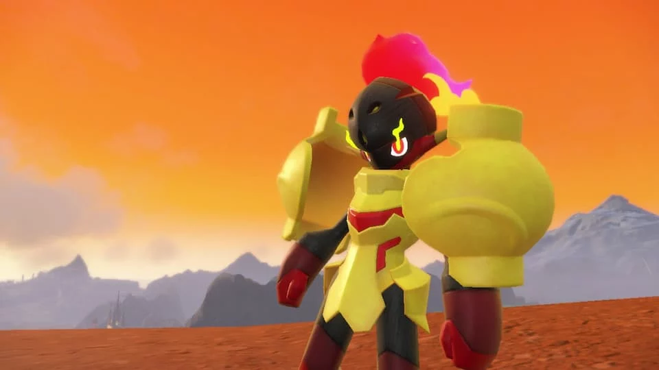 The Pokémon Armarouge. It is a humanoid shape with large yellow armor and a flame coming from its head.
