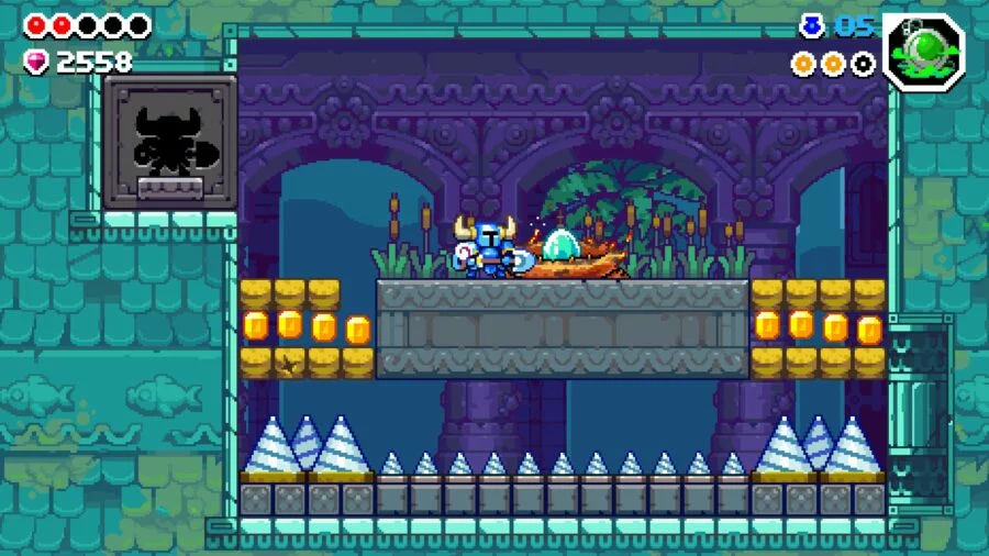 Shovel Knight in the room with an egg about to hatch in the nest