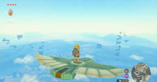 Link flying on the glider, standing in the middle to maintain balance.