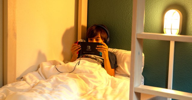 Sleepy Gamer Winds Down by Playing Switch in Bed for Three More Hours