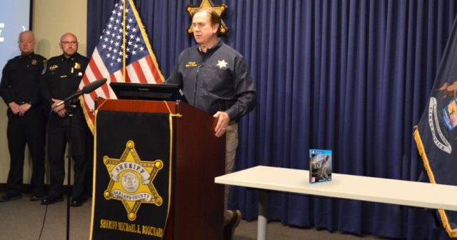 Cops Pose in Picture With Violent Video Game They Got Off the Street