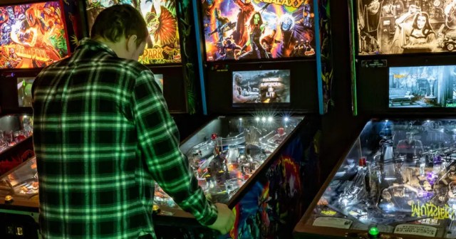 “I Know Exactly What’s Going On,” Claims Giant Fucking Liar Playing Pinball
