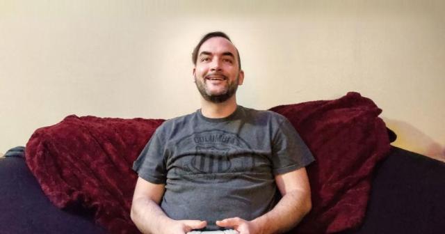 Gamer Settles in After Long Day at Work to Watch Game Install Files